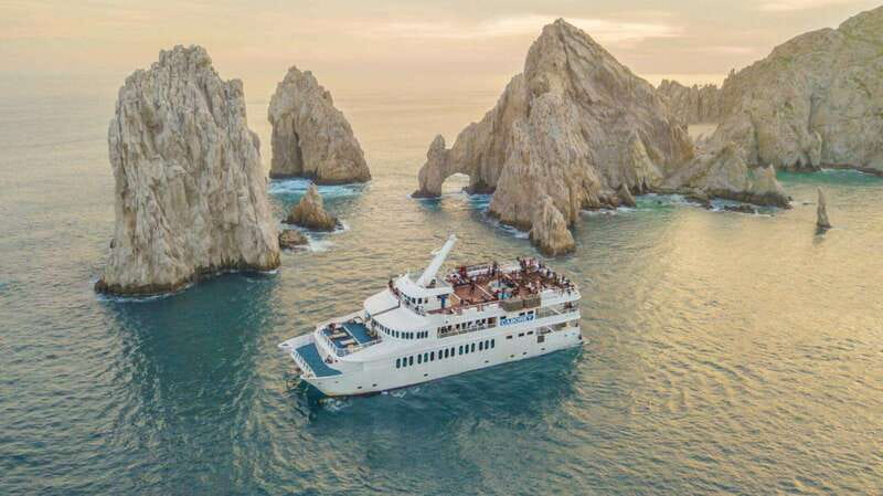 Cabo San Lucas: Sunset Premier Dinner & Show Cruise - Cruising Across Médano Bay