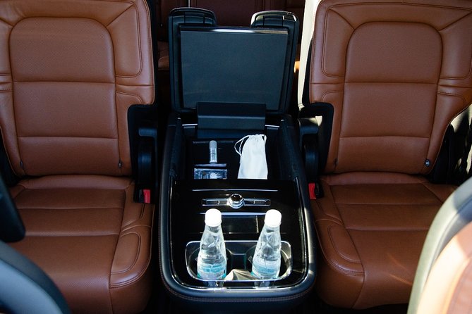 Lincoln Navigator Roundtrip Private Luxury Transportation - Bottled water, WiFi, and a comfortable cabin