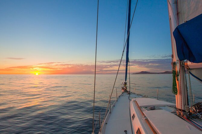 Luxury Sailboat Tour at Sunset in Los Cabos + Snacks + Premium Drinks - Pickup, meeting point, and the extra fees