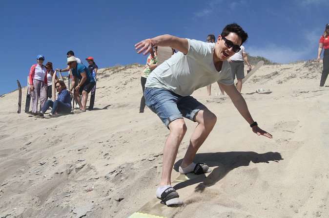 Private Sandboarding Experience in Los Cabos - Trucks, tents, chairs, and the practical setup